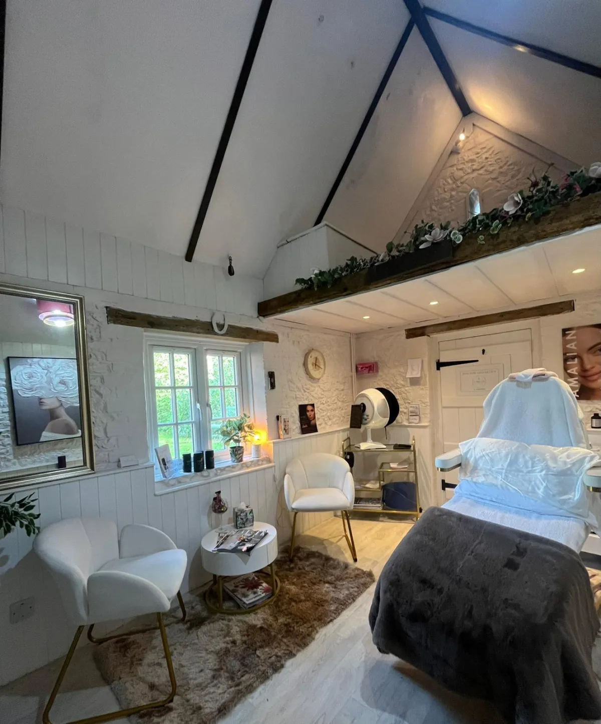 white plastic pump bottle beside pink tulips and gray towel