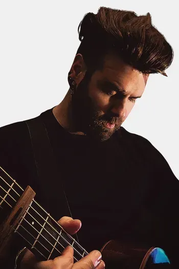 Guitarist posing with acoustic guitar