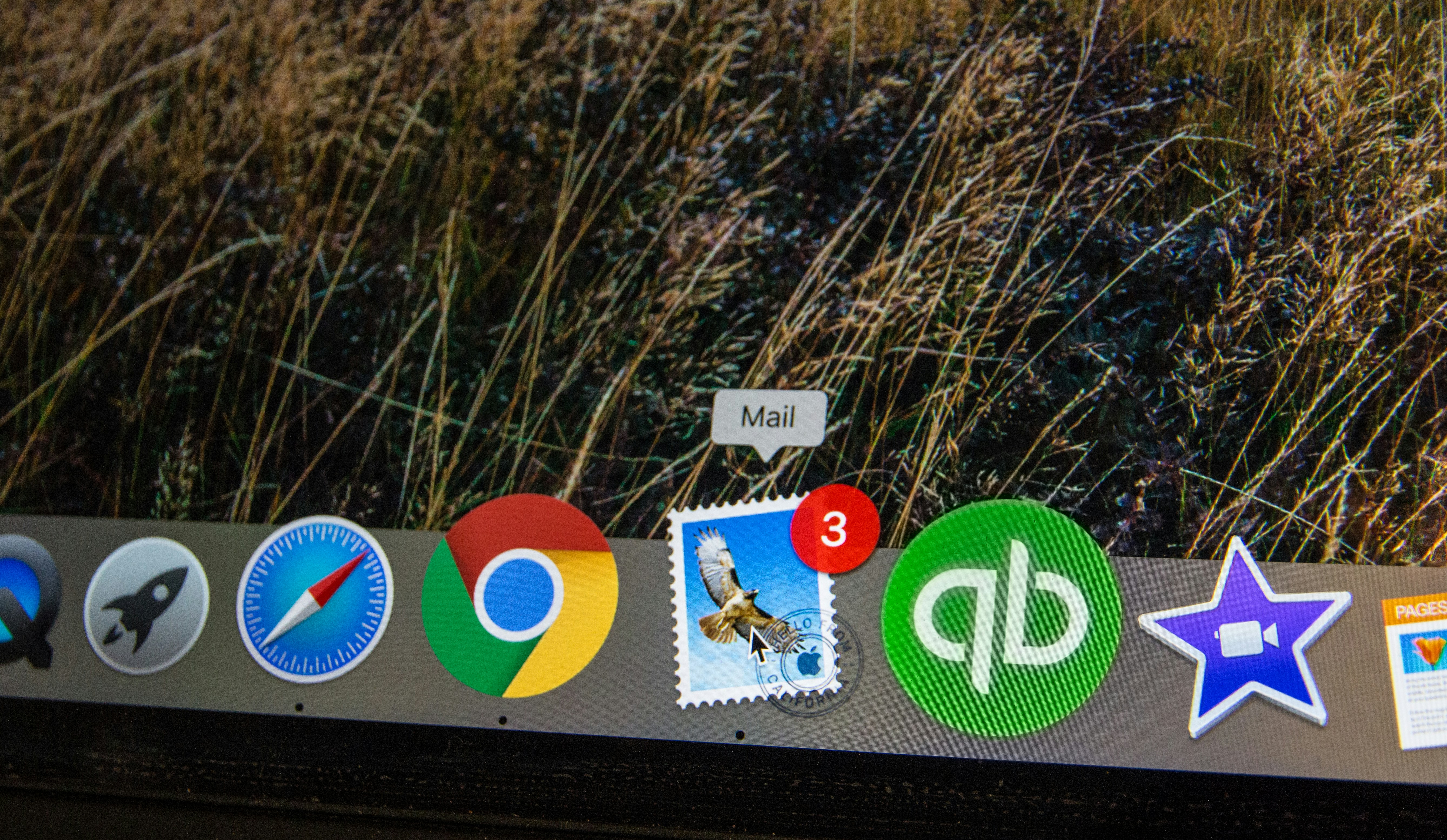 Small business owner overwhelmed by multiple software subscriptions on laptop screen, representing tool overload and automation inefficiency"