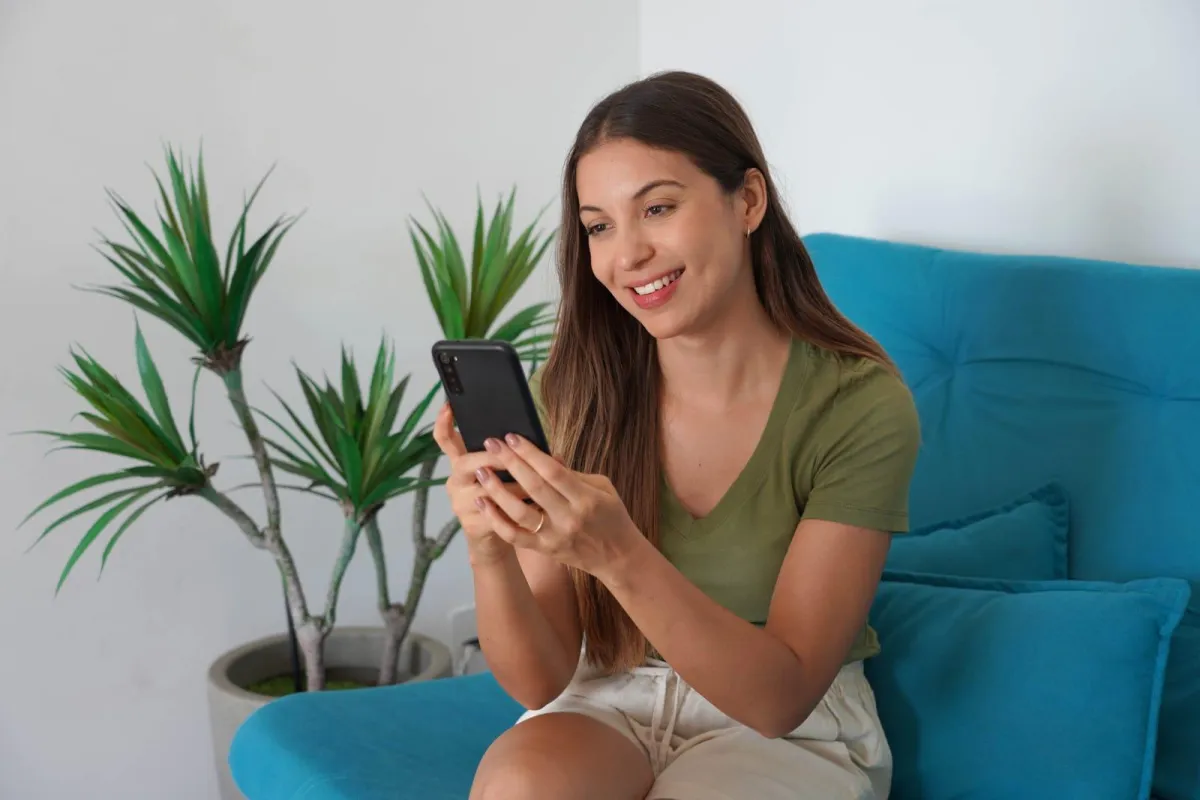 brown wooden framed yellow padded chair