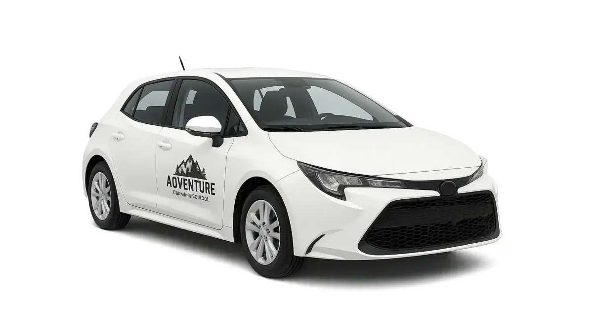 Modern white compact driving school car with 'Adventure Driving School' logo on the door.