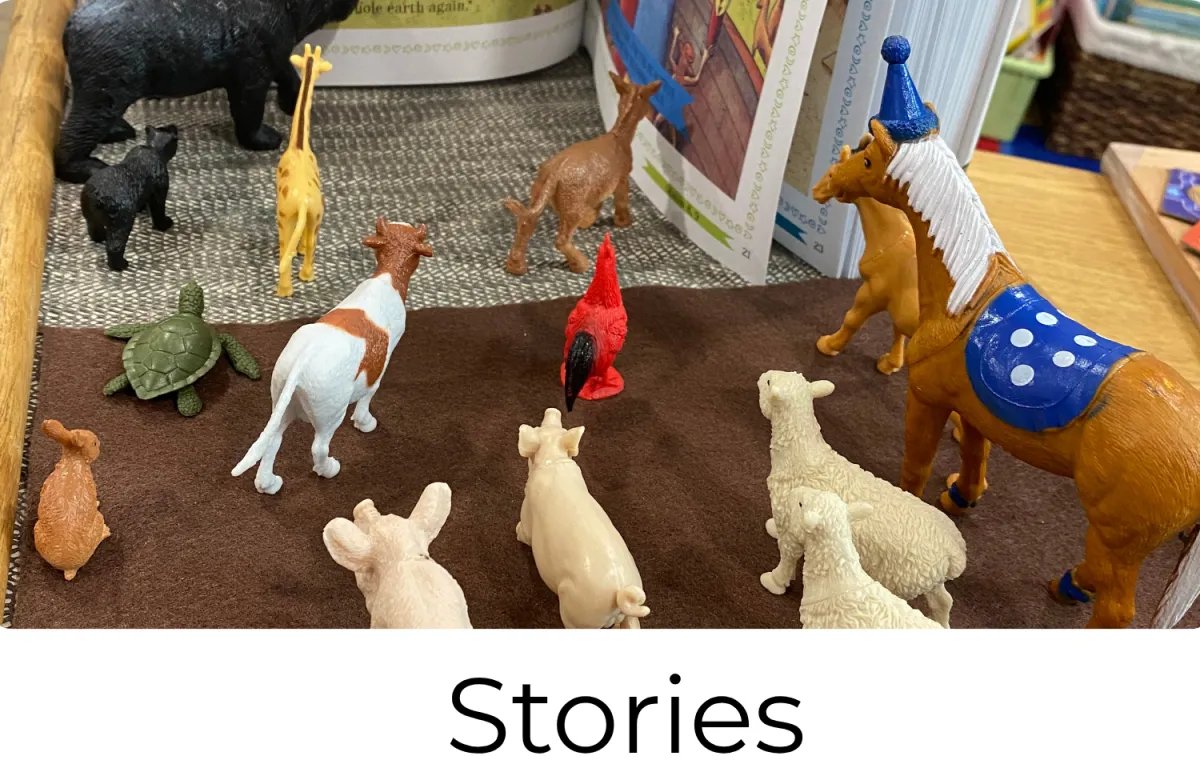Farm animal figures used for hands-on storytelling and language learning in a Montessori preschool classroom