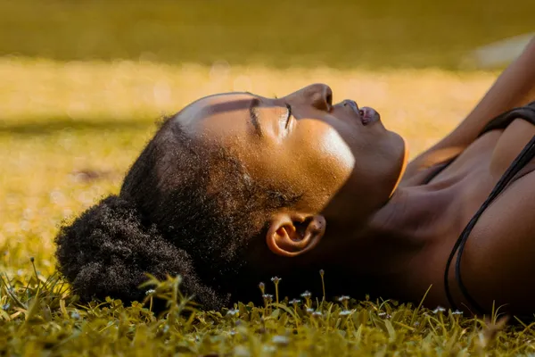 Lady grounding and deep breathing to regulate nervous system