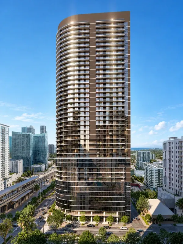 Vista exterior de One Twenty Brickell Signature Residences, torre residencial de lujo en Brickell, Miami, con arquitectura moderna, balcones curvos y fachada de cristal.
