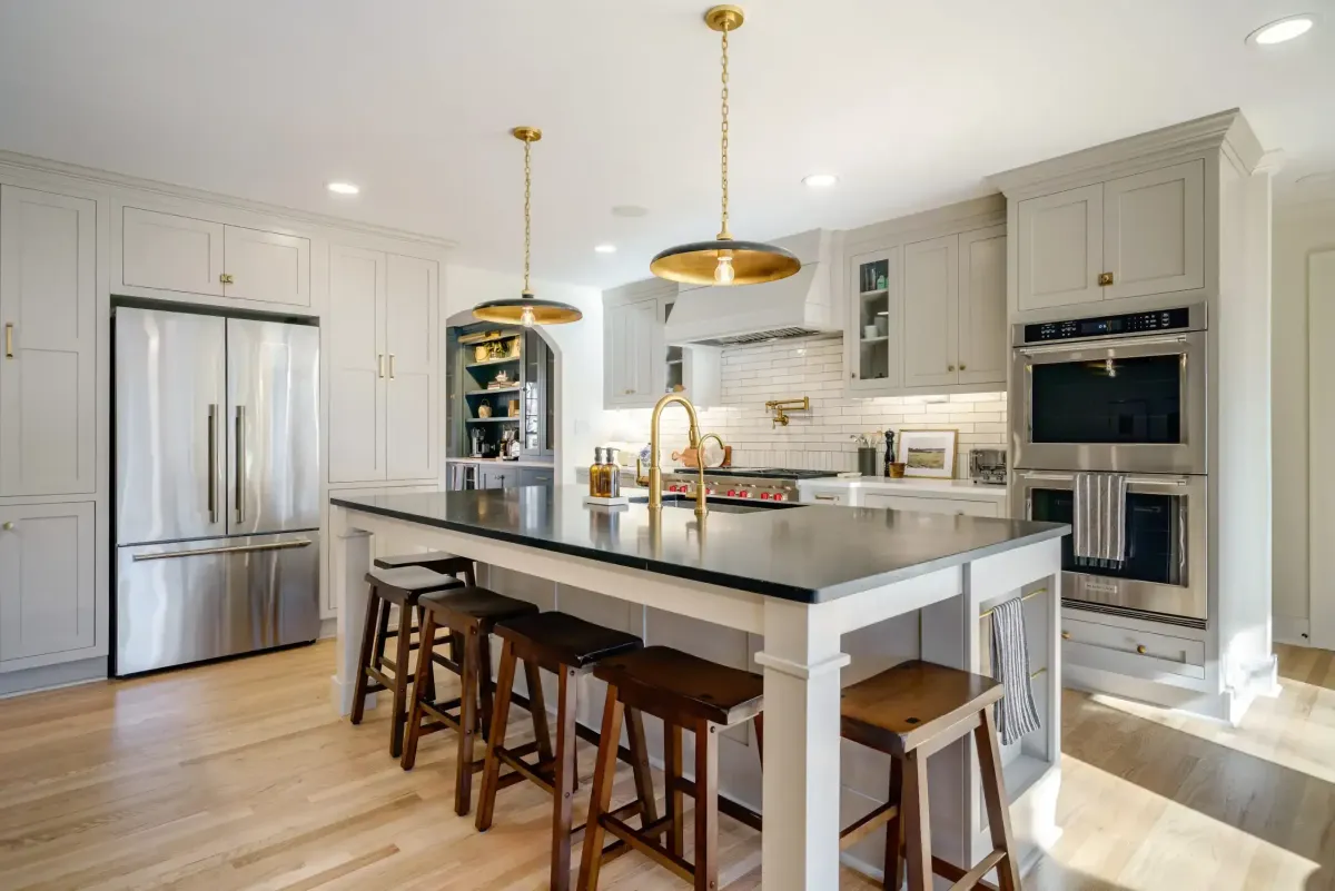 Completed modern kitchen in Myrtle Beach with sleek cabinetry granite countertops stainless steel appliances and coastal decor