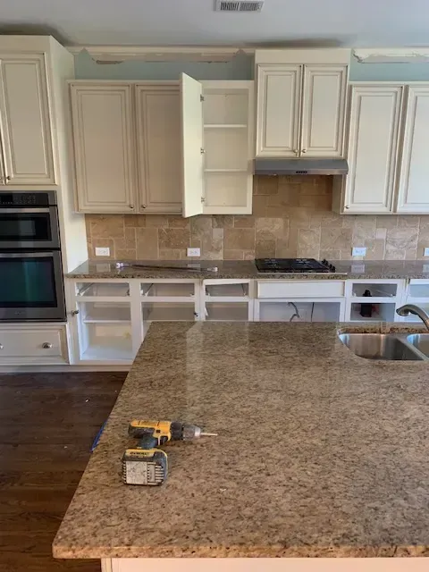 Completed Myrtle Beach deck removal showing cleared backyard, green grass, landscaping, ocean view, palm trees, and blue sky