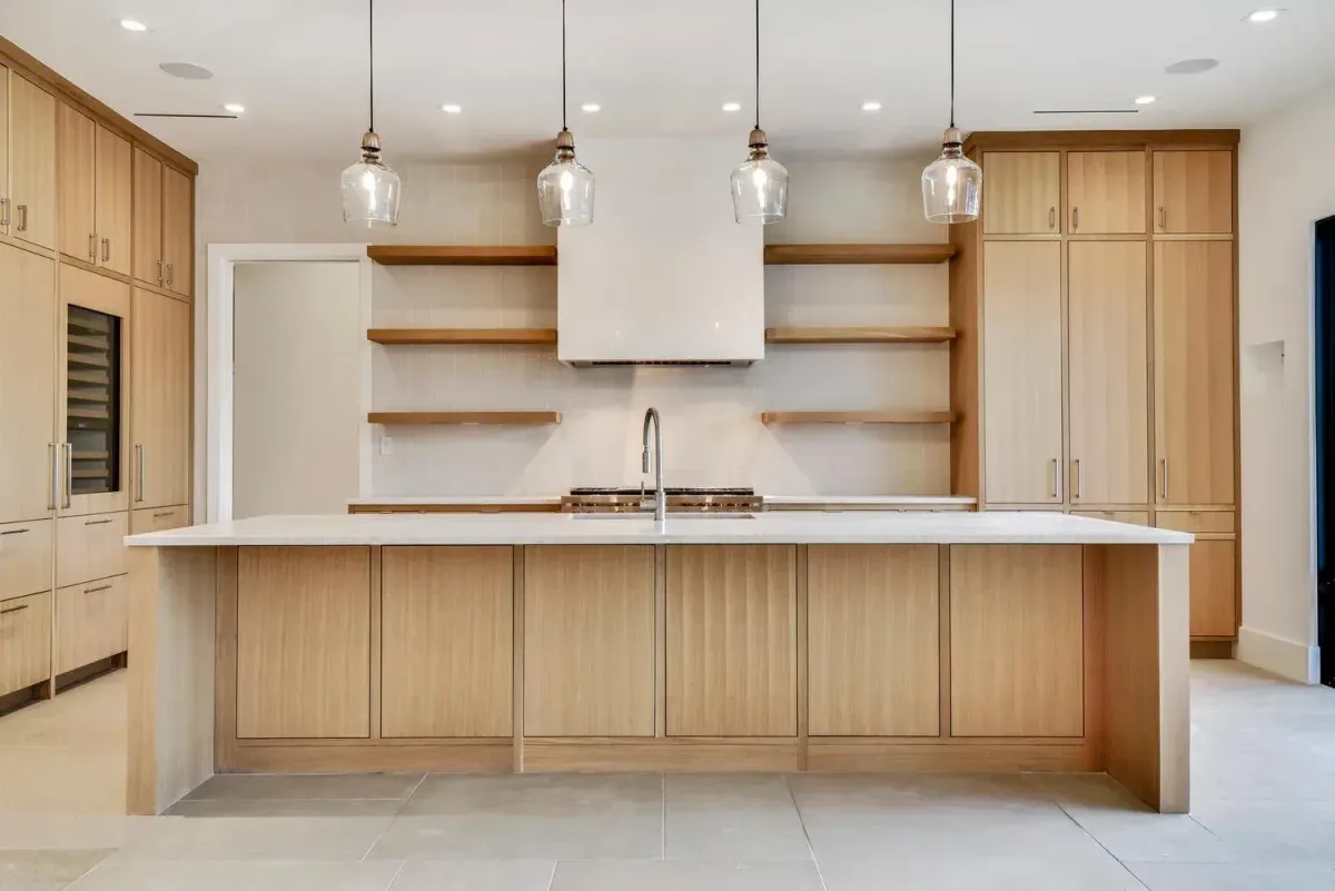 Modern Myrtle Beach bathroom with sleek wood cabinets, polished vanity, stone countertop, and glass shower