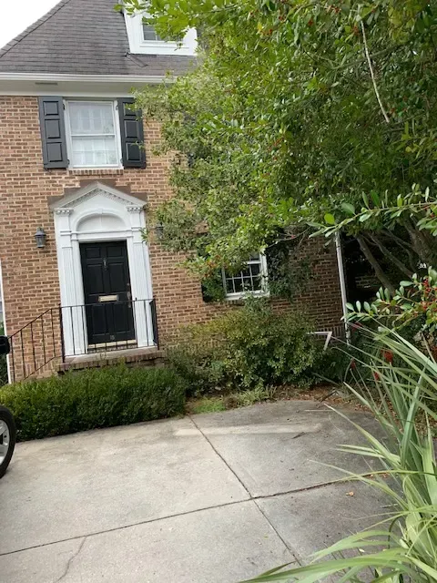 Completed modern window and door installation in Myrtle Beach with coastal landscaping and bright sunlight