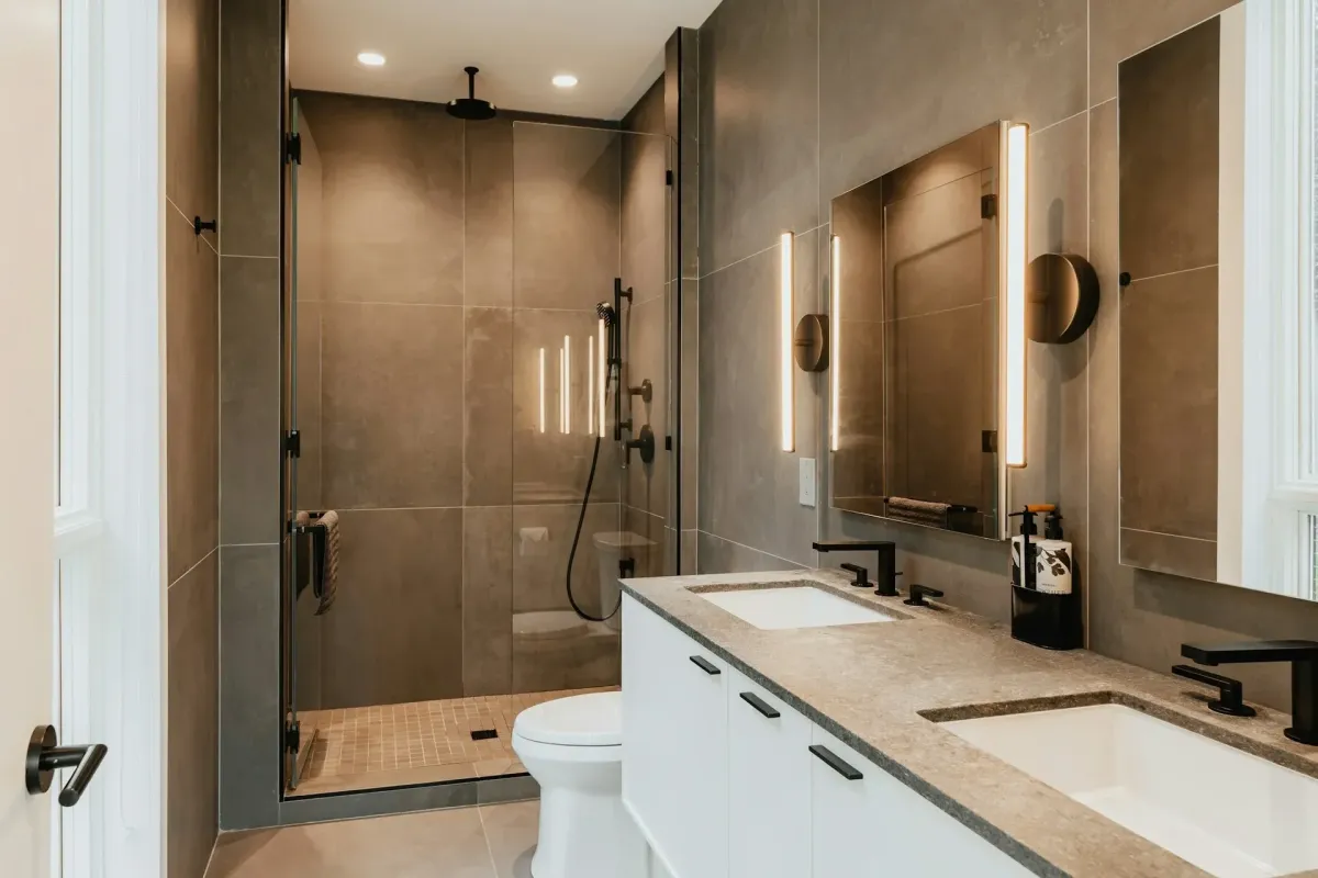 Completed Myrtle Beach bathroom with walk-in shower, modern fixtures, marble tiles, coastal decor, and natural light