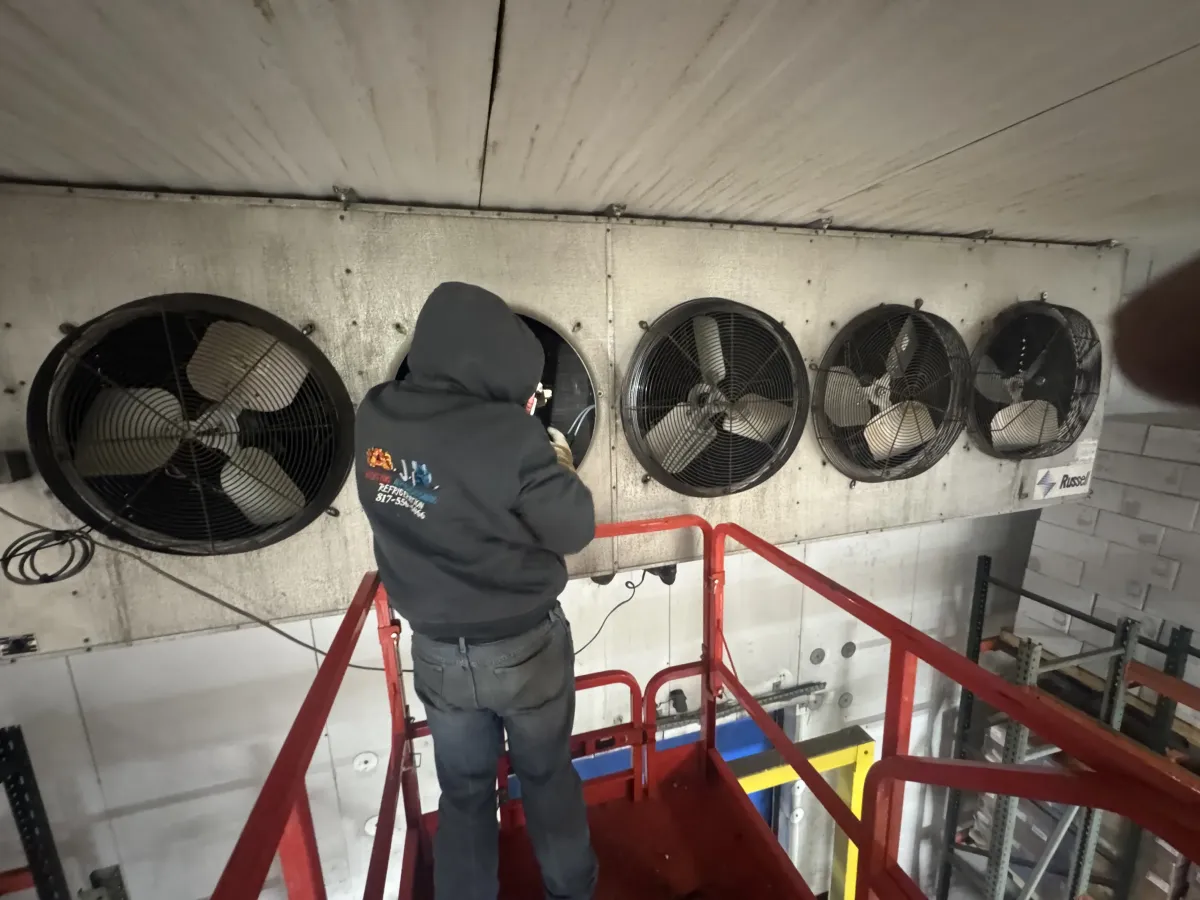 Springtown TX commercial HVAC repair scene on rooftop with maintained unit, tools, cityscape, and clear sky