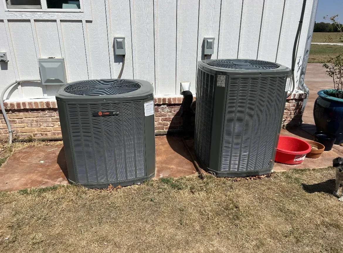 Completed commercial HVAC repair in Weatherford TX with modern unit, clean building, landscaped surroundings.