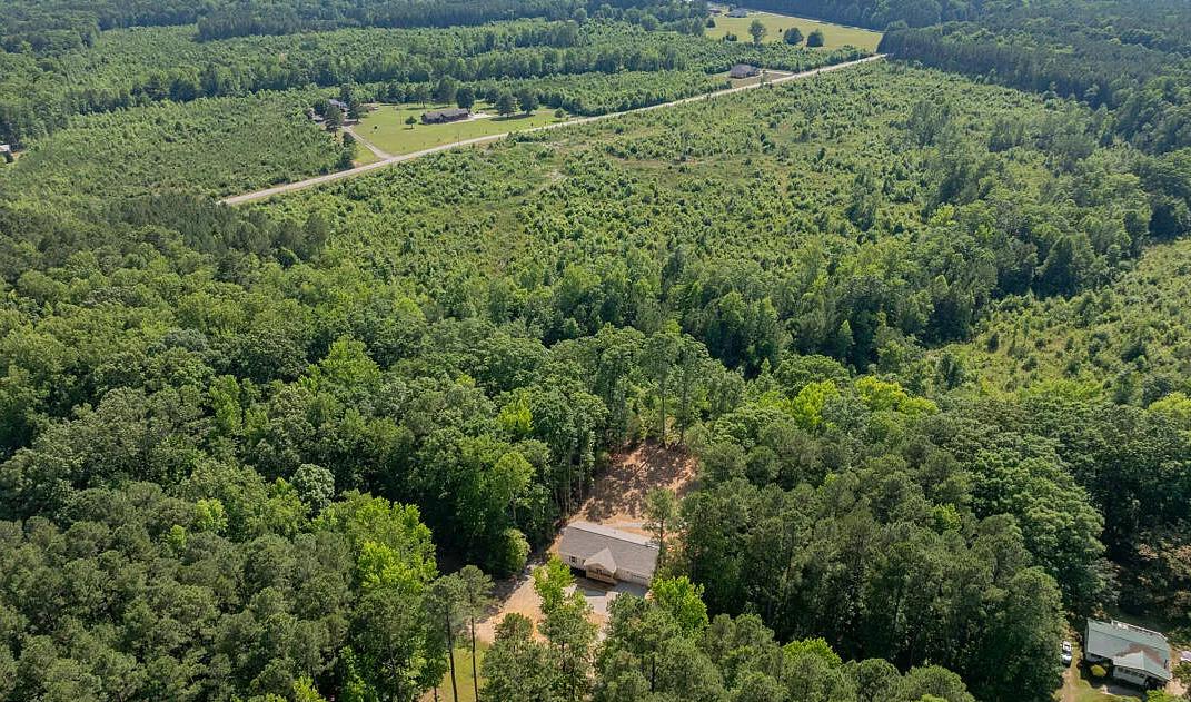 Ariel view of land with newly built home