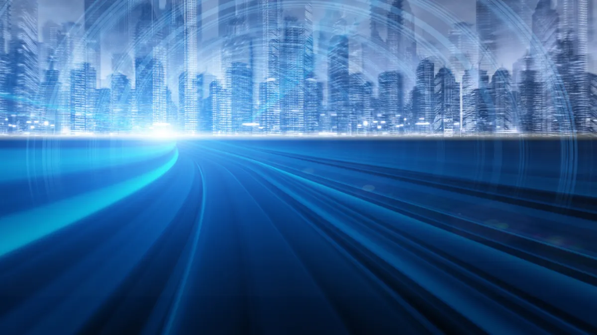 a person holding an airpods in front of a keyboard