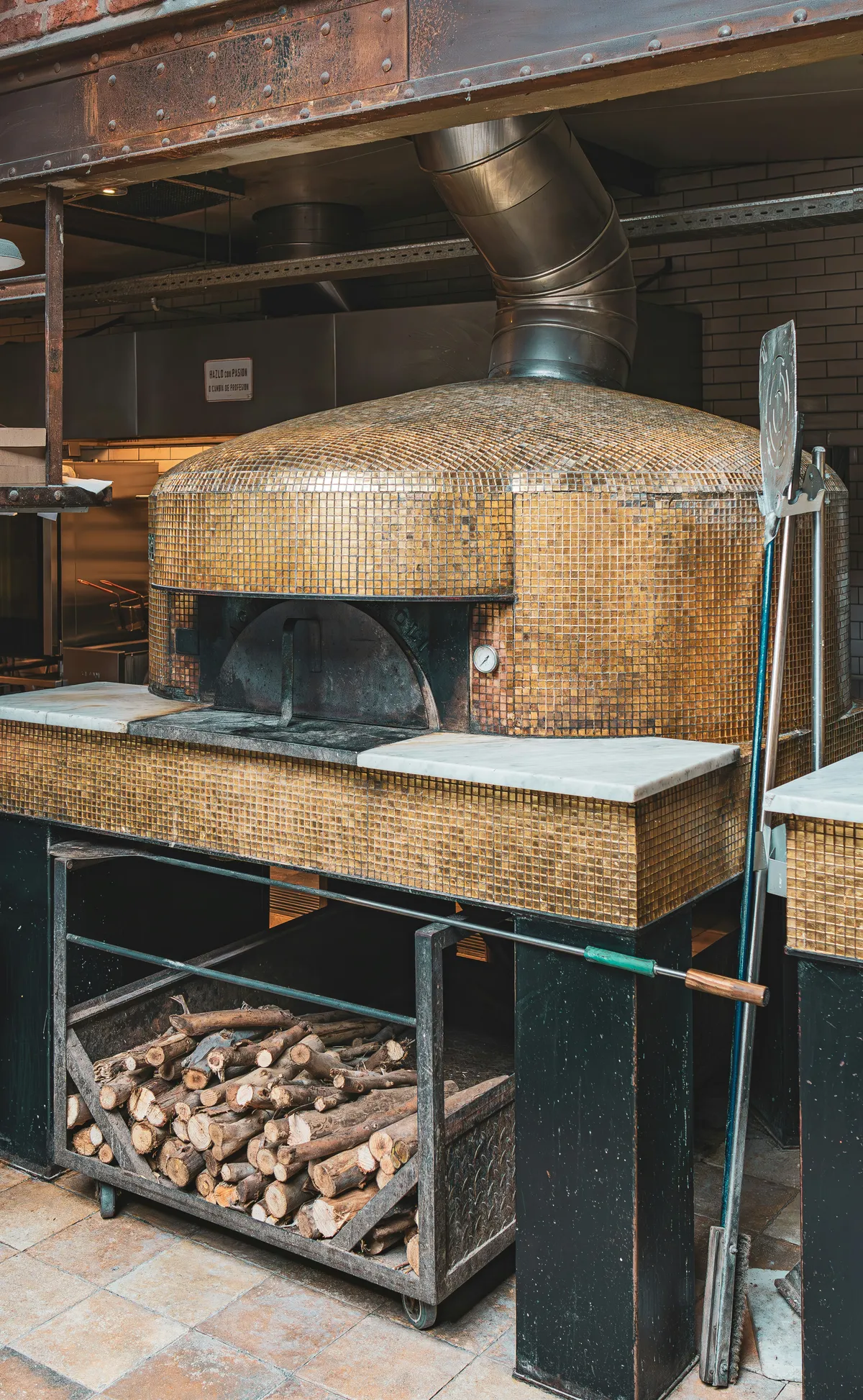 Pizza oven in a busy pizza shop kitchen