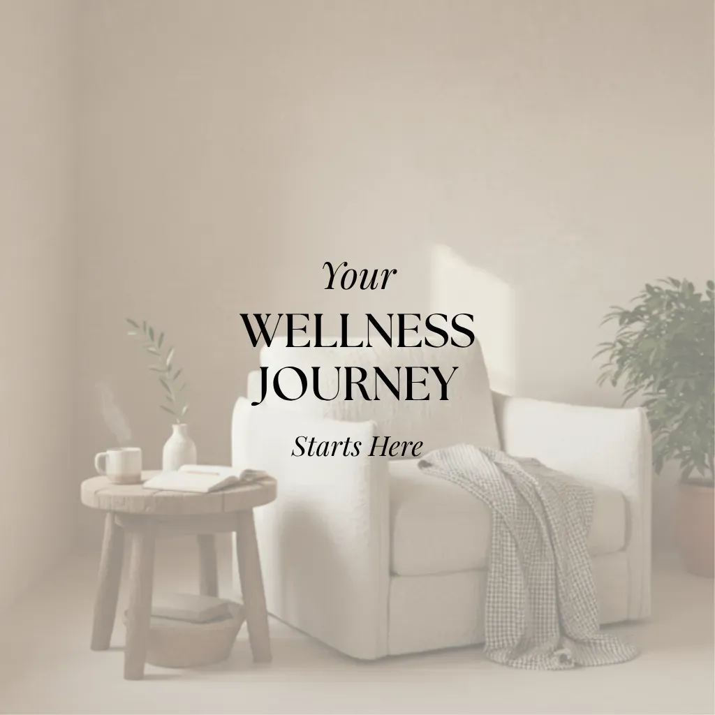 Cozy, candid photo of a woman in a warm living room holding a mug and smiling.