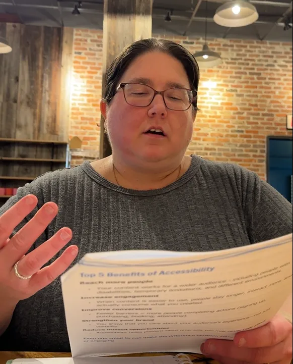 Jenn reading from workbook