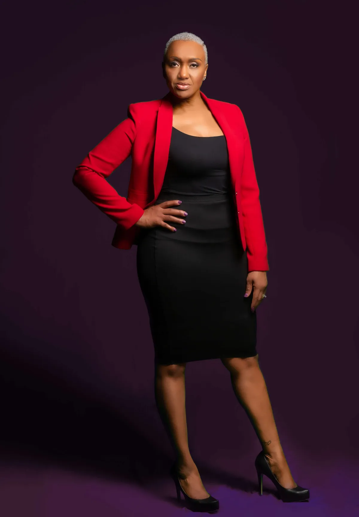 black woman in red suit in sterling virginia photoshoot