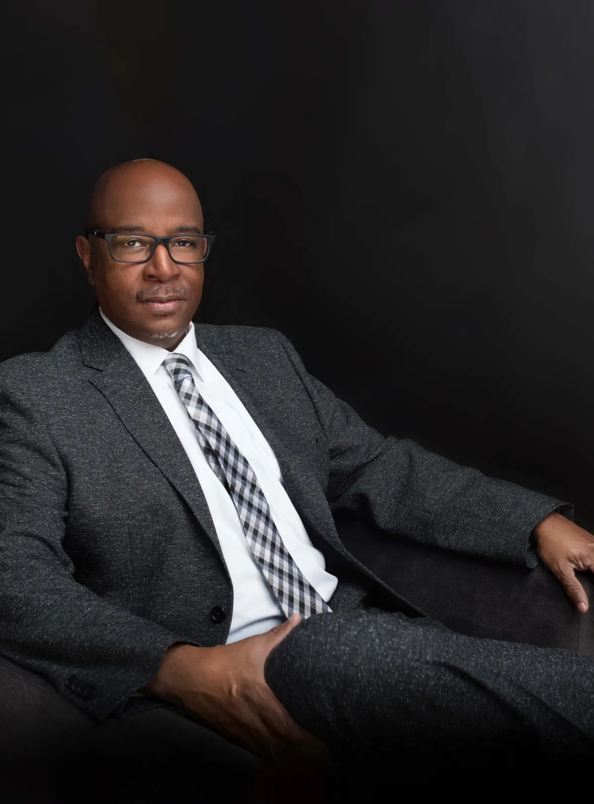 man in suit black background with glasses corporate photography leesburg virginia studio