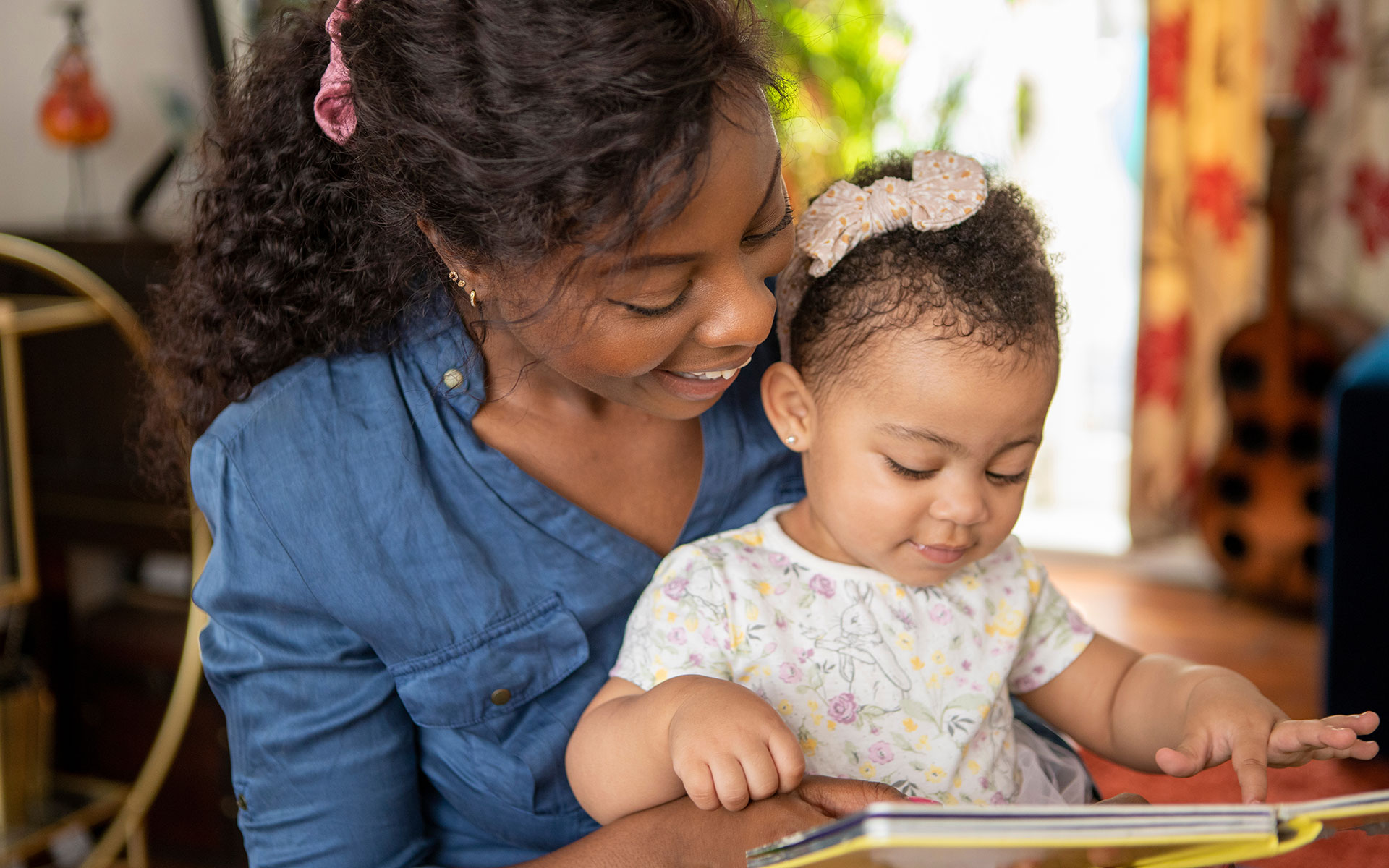 Mother and child reading a book together