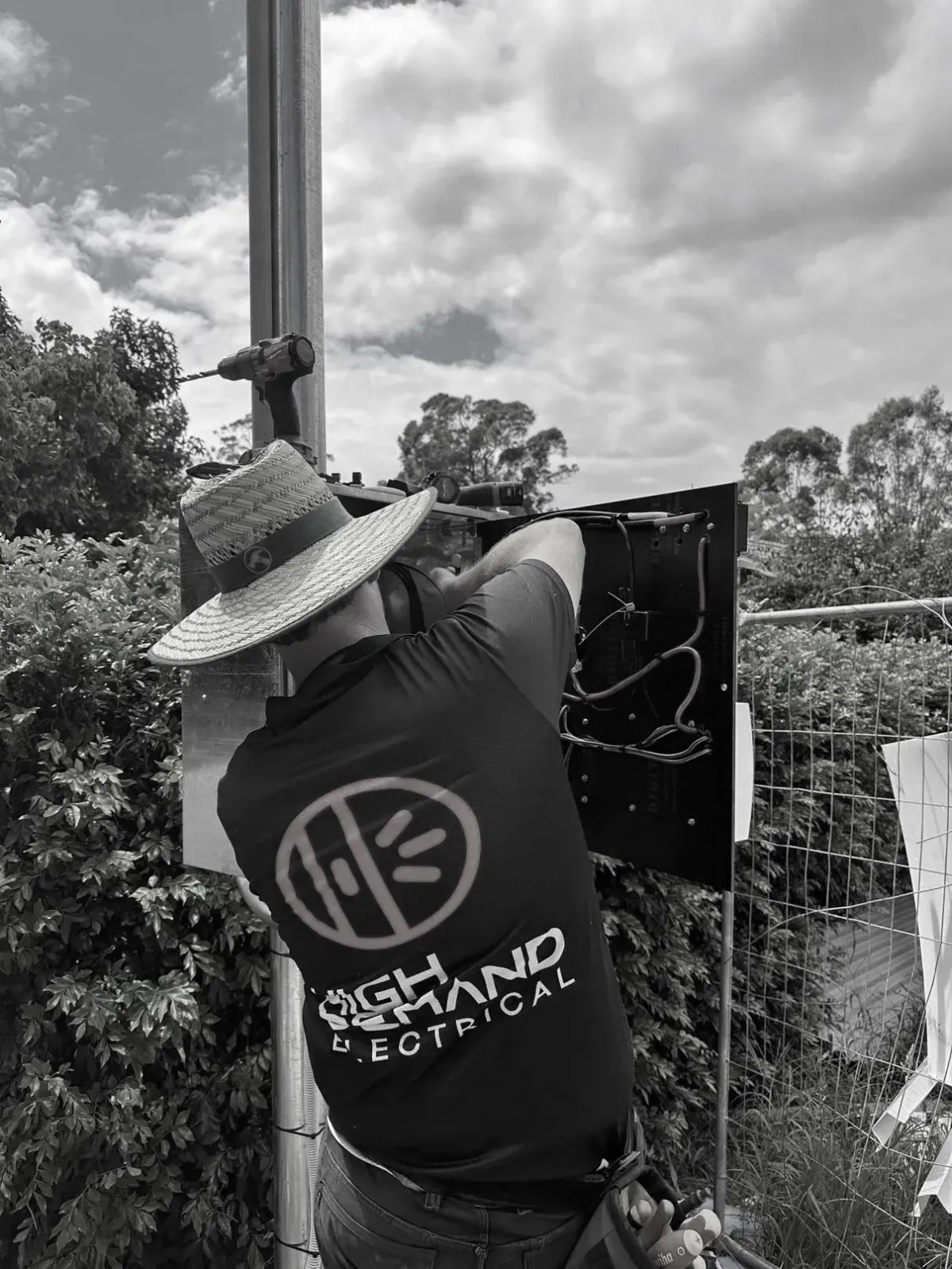 Electrician performing 24/7 emergency electrical make safe service on power lines after flood damage in Sydney.