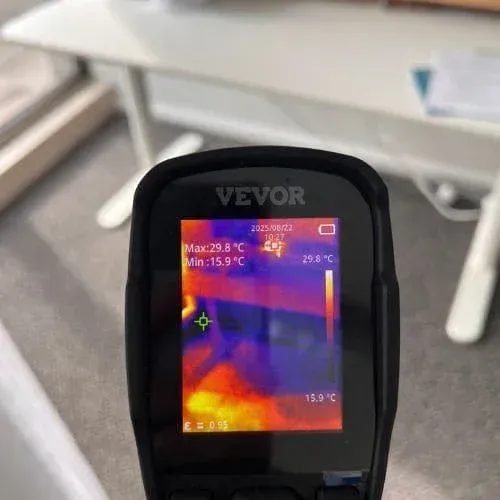 Thermal imaging camera detecting hidden moisture during mould inspection.