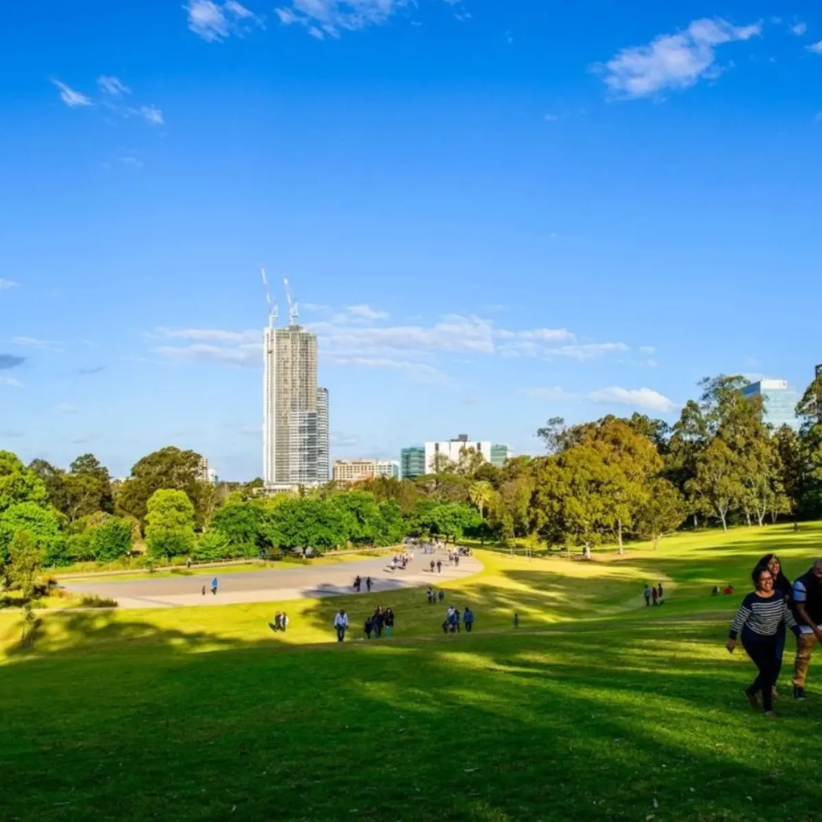 Centennial Parklands with people enjoying open green space, showcasing the natural areas within Sydney serviced for water, flood, and mould restoration.