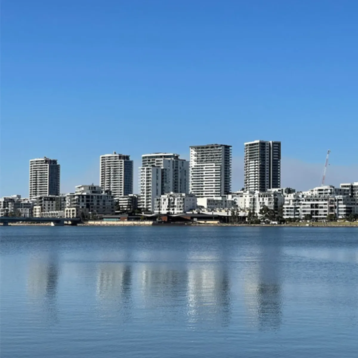 Modern residential buildings along the Rhodes waterfront, illustrating High Demand Restoration’s commitment to professional water and flood restoration for high-rise and waterfront properties across Sydney.