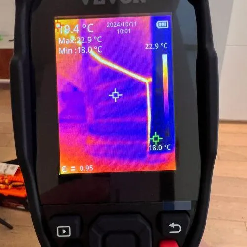 Moisture meter showing thermal image for water damage assessment during mould inspection.
