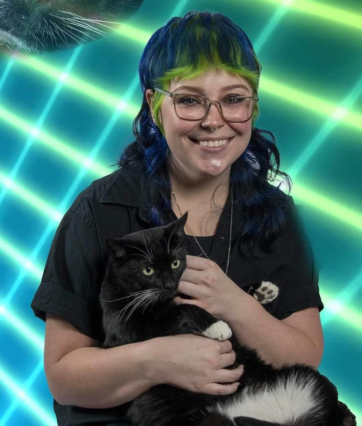 Grey (Associate Stylist) holding Jinx (one of the Salon Cats)