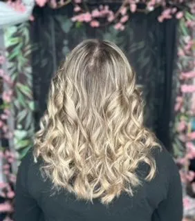 a balayage done on a model with a black shirt