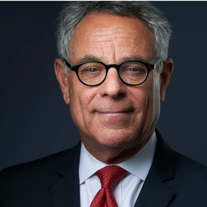 Professional corporate headshot of NYC executive in business suit