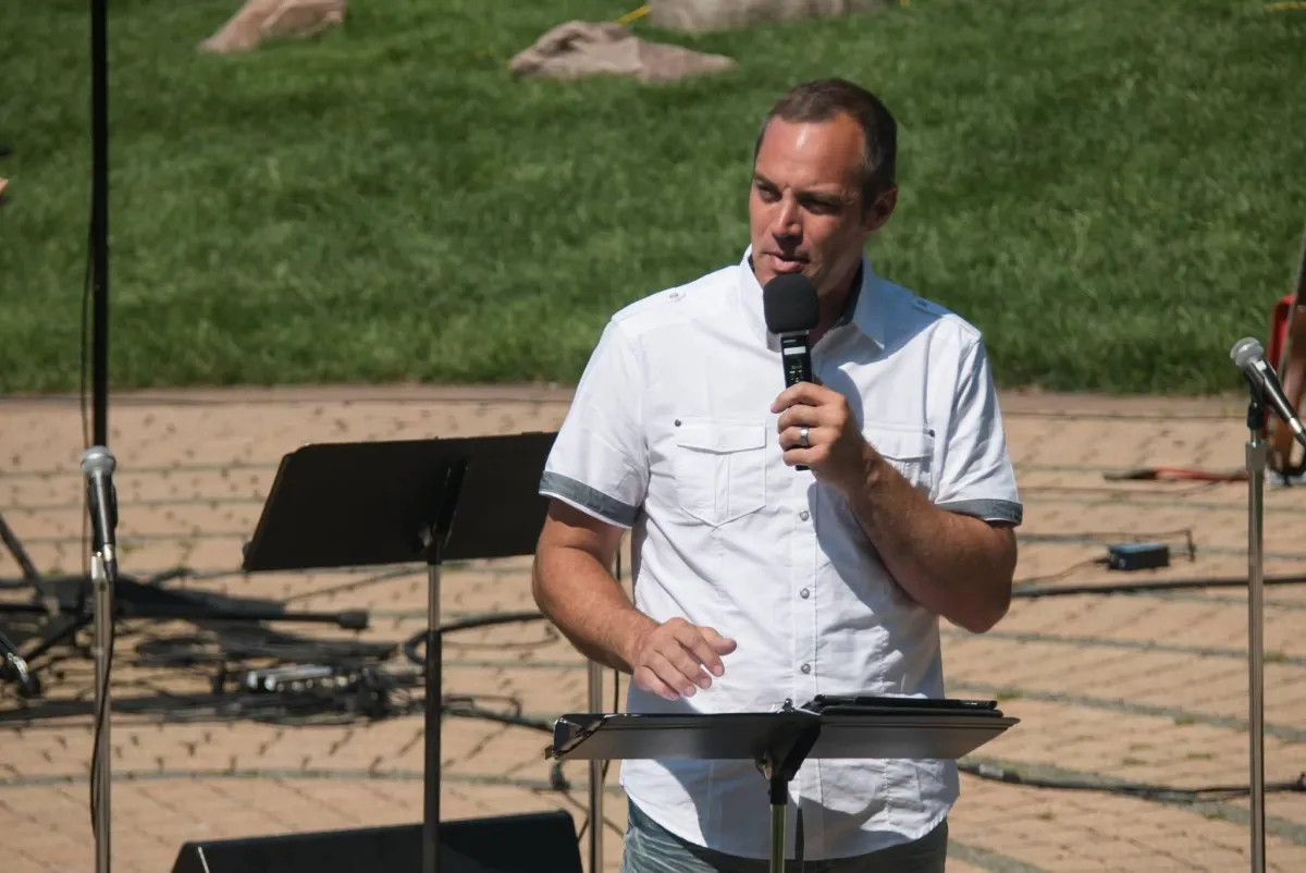 Pastor Jerry Simmons, 238 Church in DeForest, Wisconsin delivering an outdoor sermon at 238 Church in DeForest, Wisconsin.