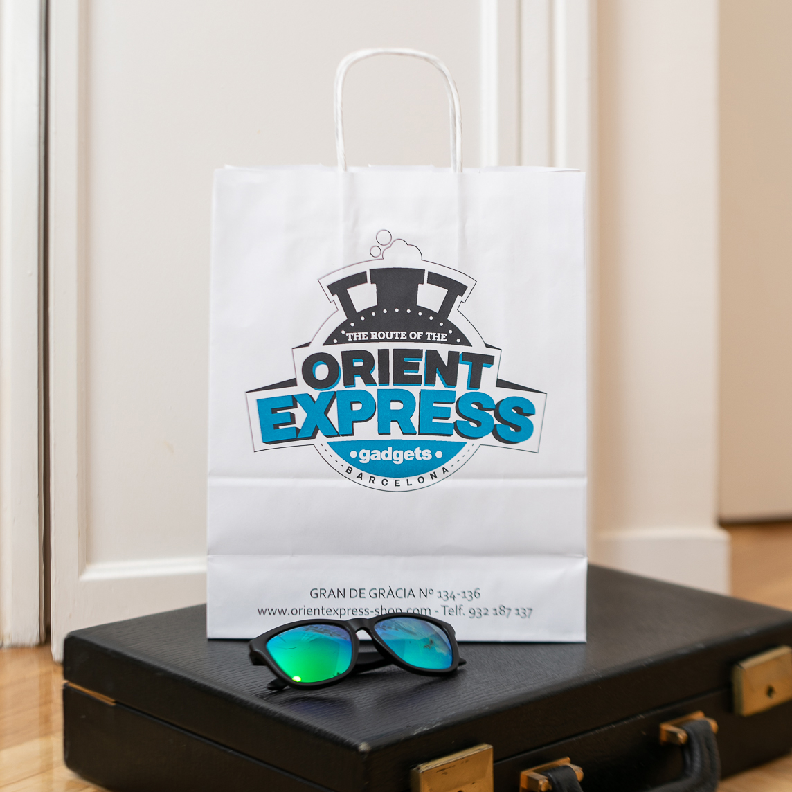 two clear glass jars with brown and black beads