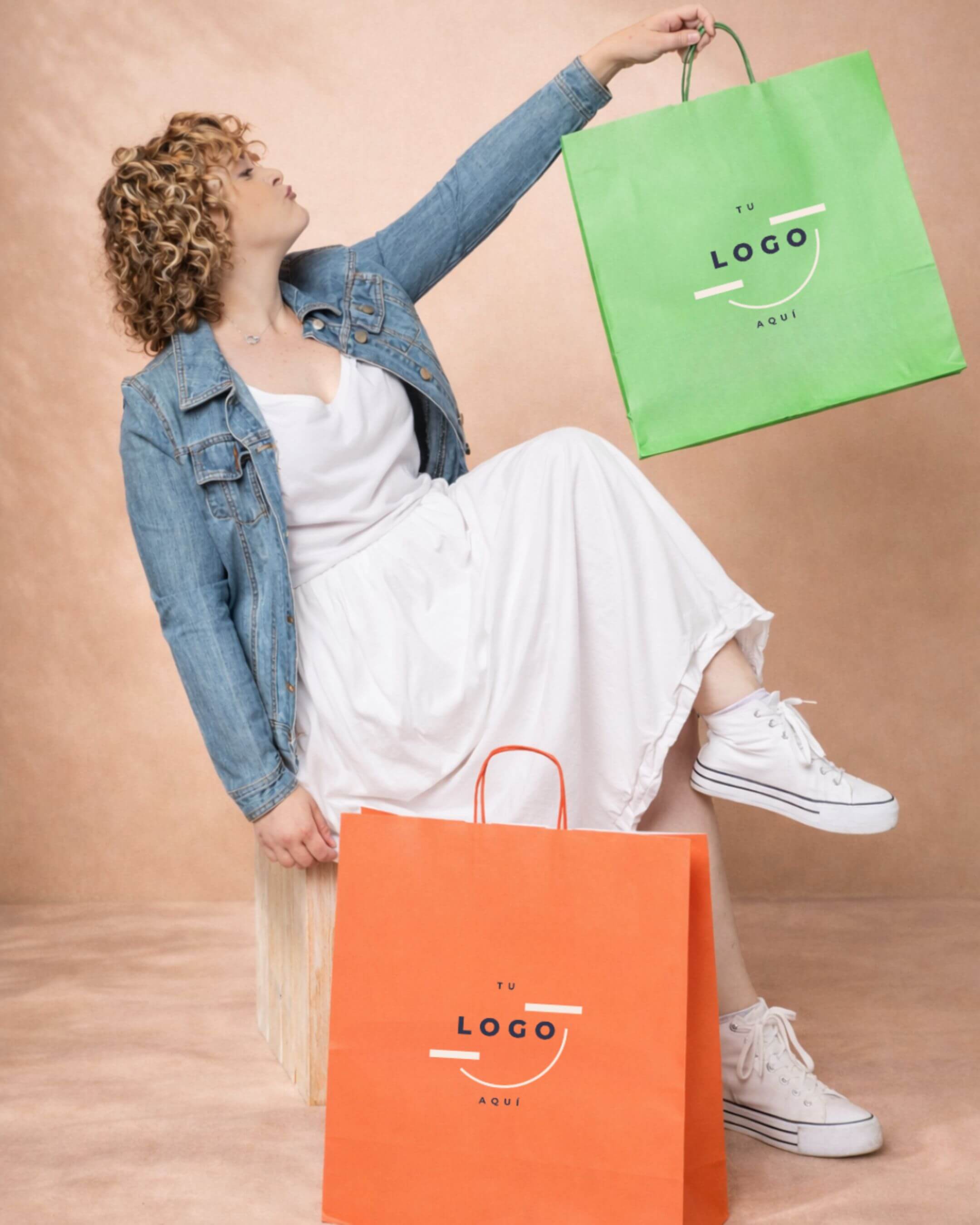 Glass bottles with white sleeves on purple background.