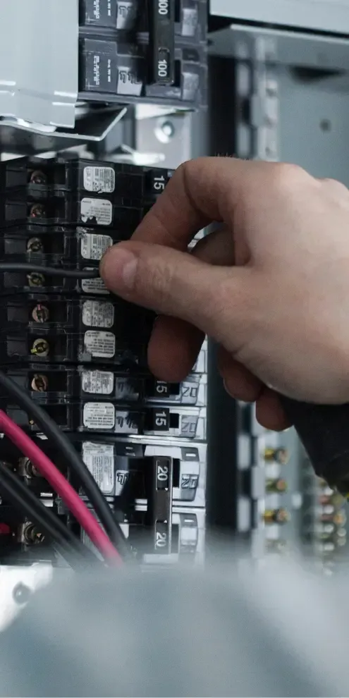 electrician working on electrical panel