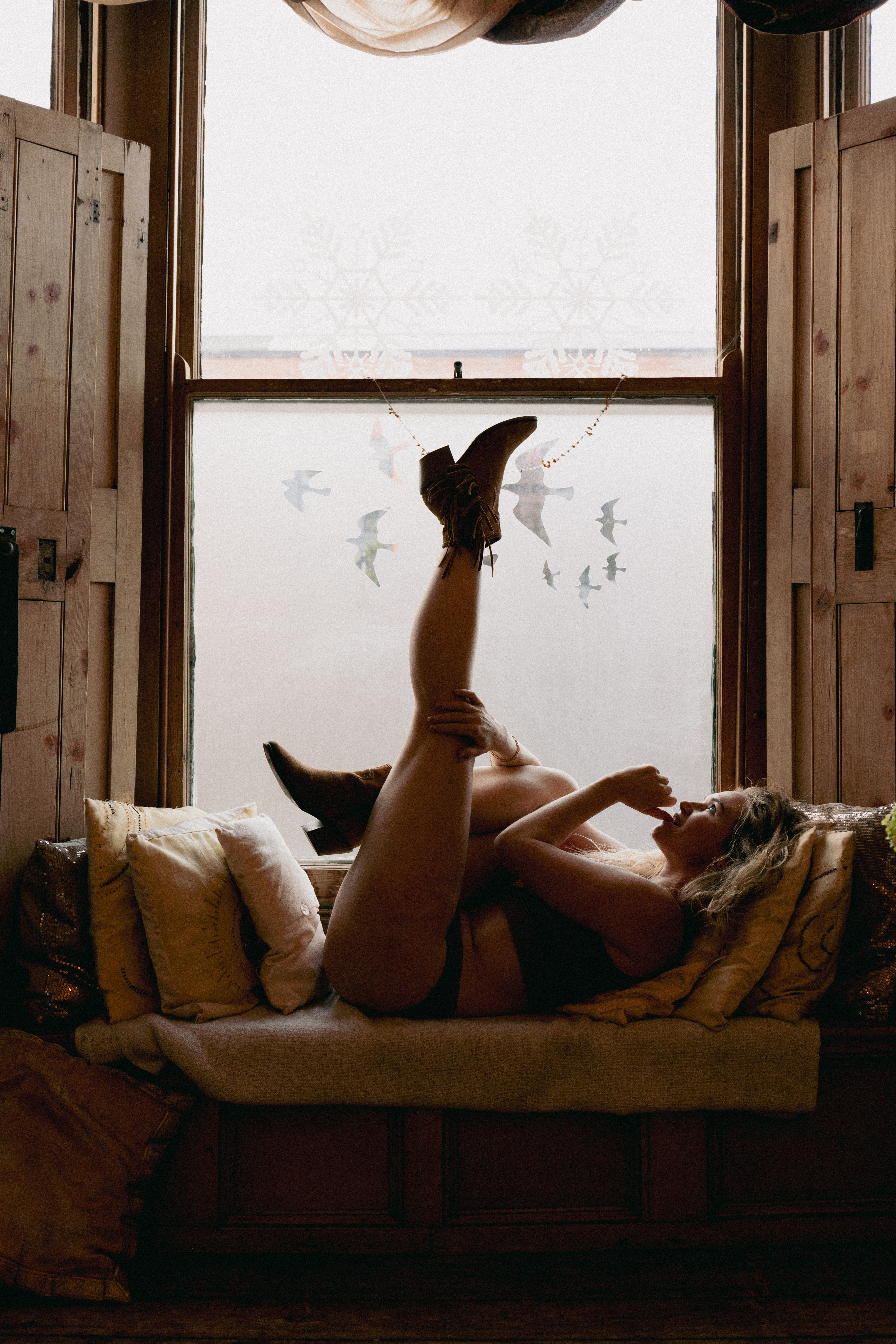 a group of women sitting outside in sunset meditating together as empowerment