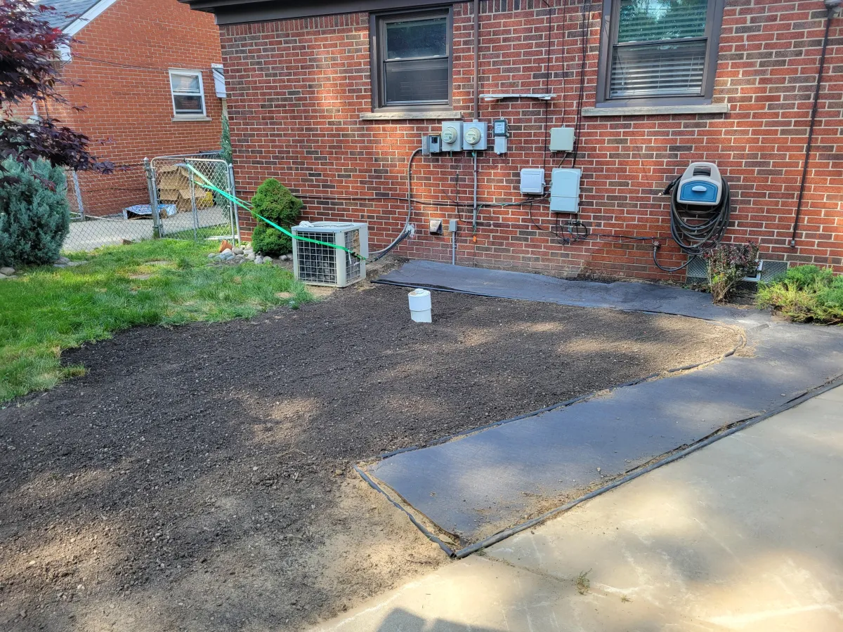 Before Landscaping Installation for a brick home in Dearborn, MI