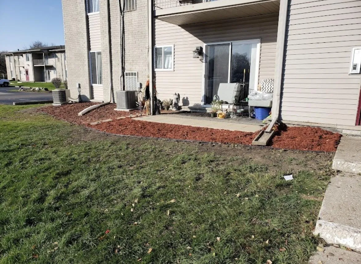 Beige colored duplex with landscaping installation in Allen Park, MI