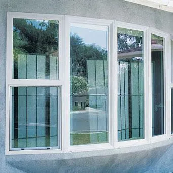 man sitting beside white wooden table
