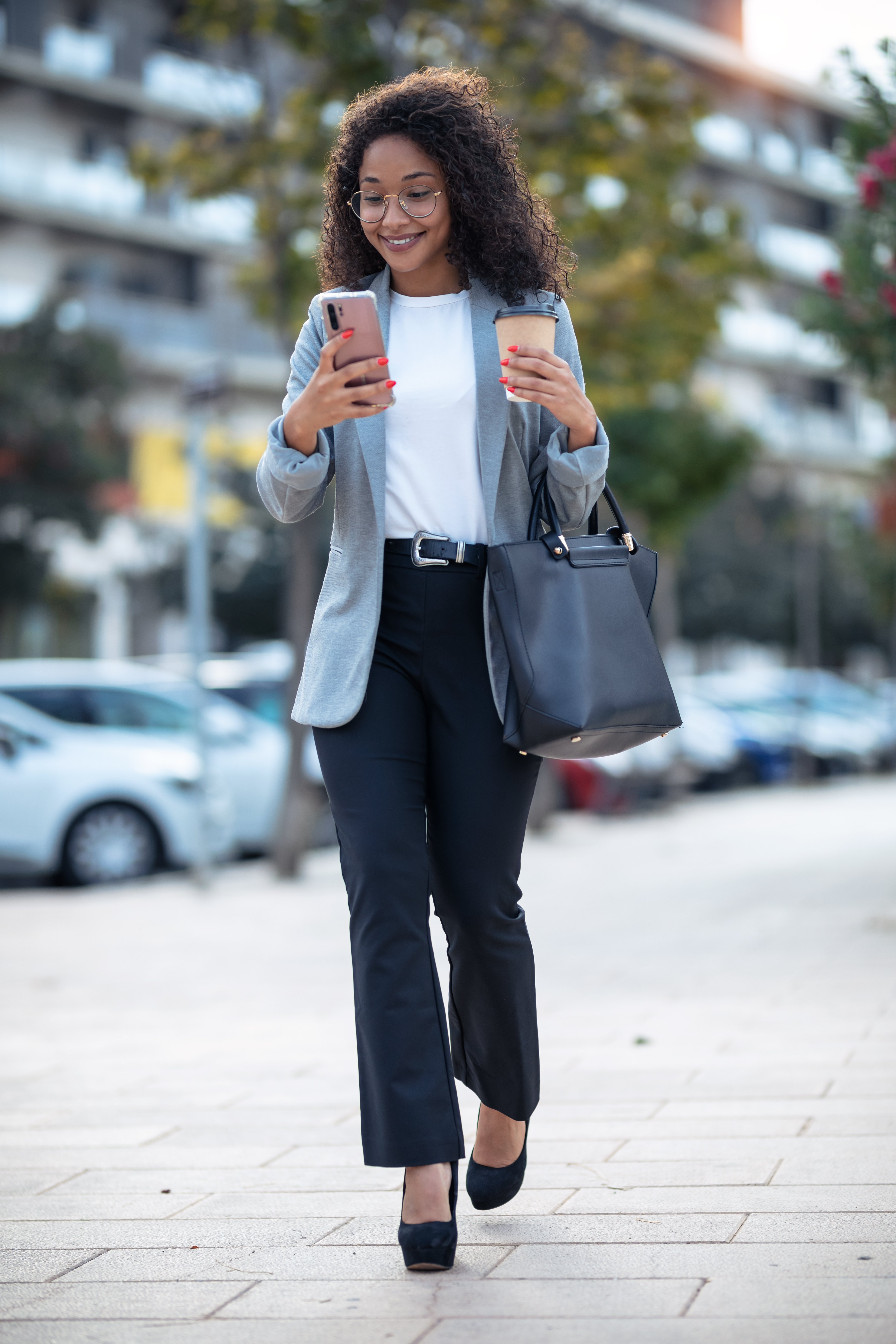 Professional woman walking down the street