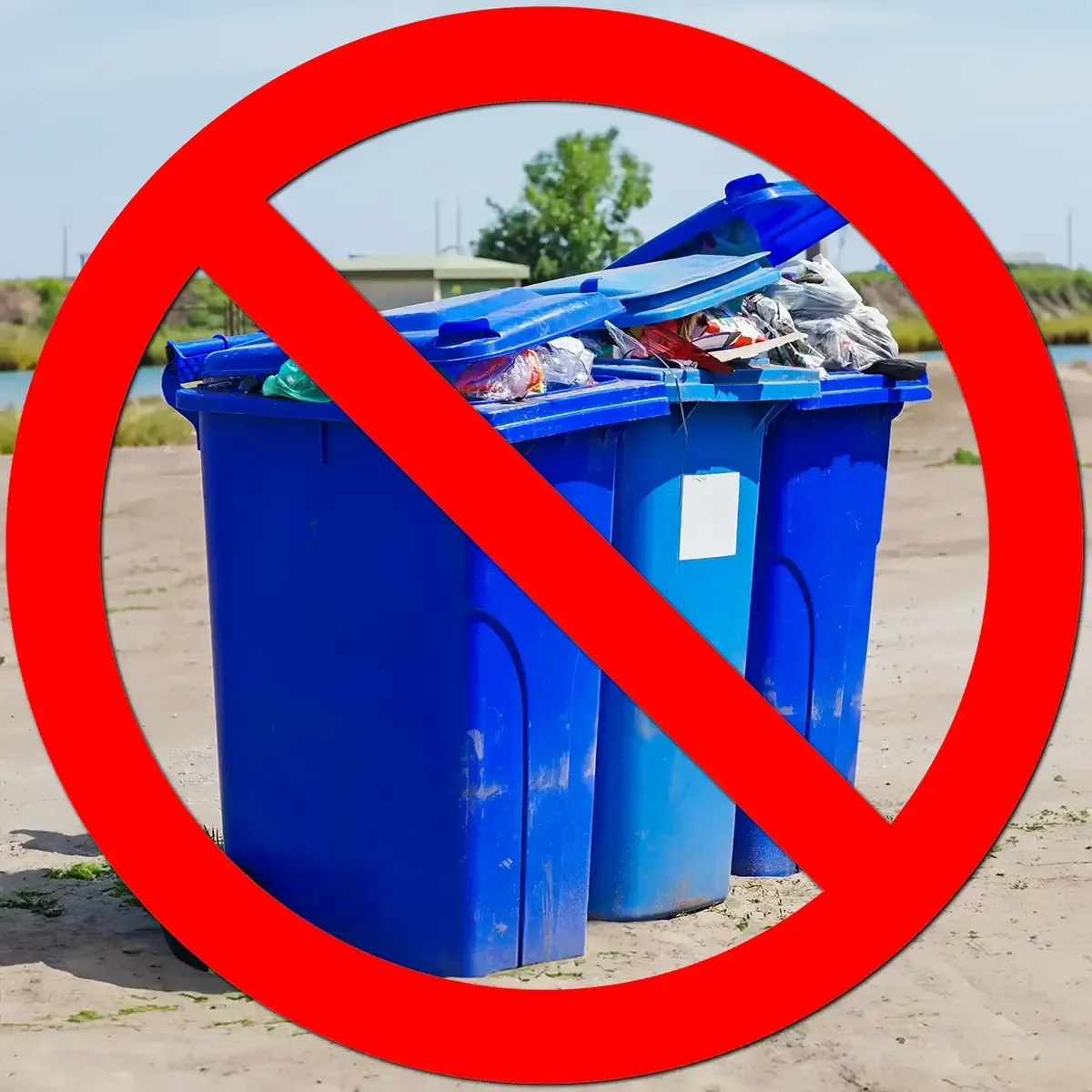 Trash Basher compressing a yard-waste bag in a green municipal bin, suburban driveway background, photorealistic lifestyle action photo