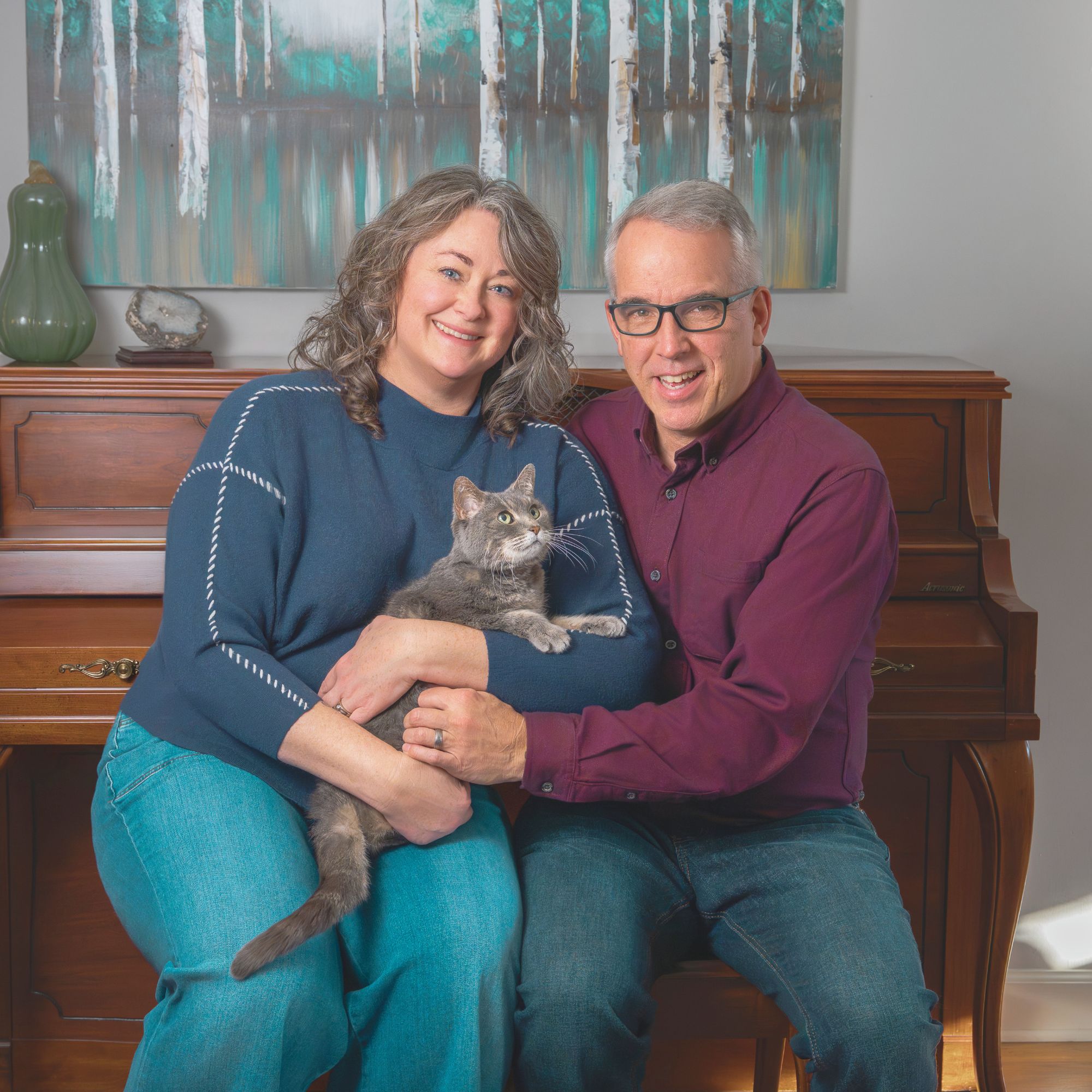 Jaime and Gunther Kuhn standing together in a natural, softly lit setting