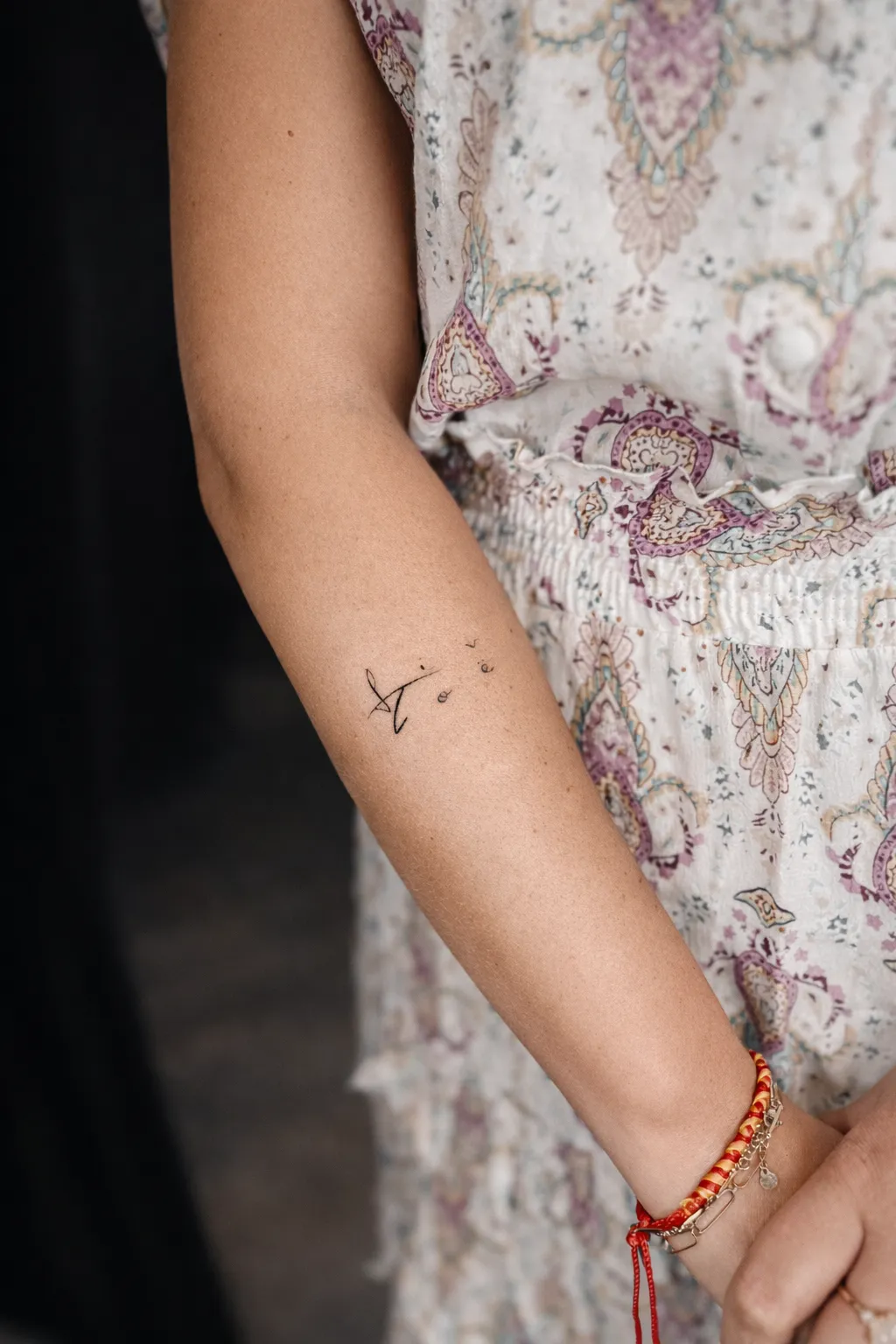 person with tattoo on right arm