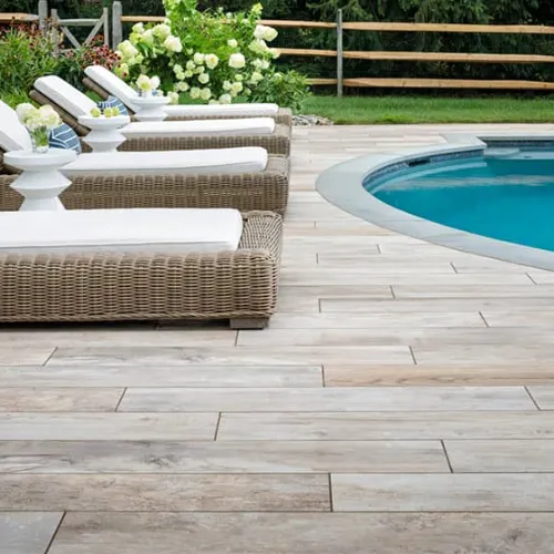 Slip-resistant pool deck resurfacing in Sarasota, FL with cool textured concrete coating.