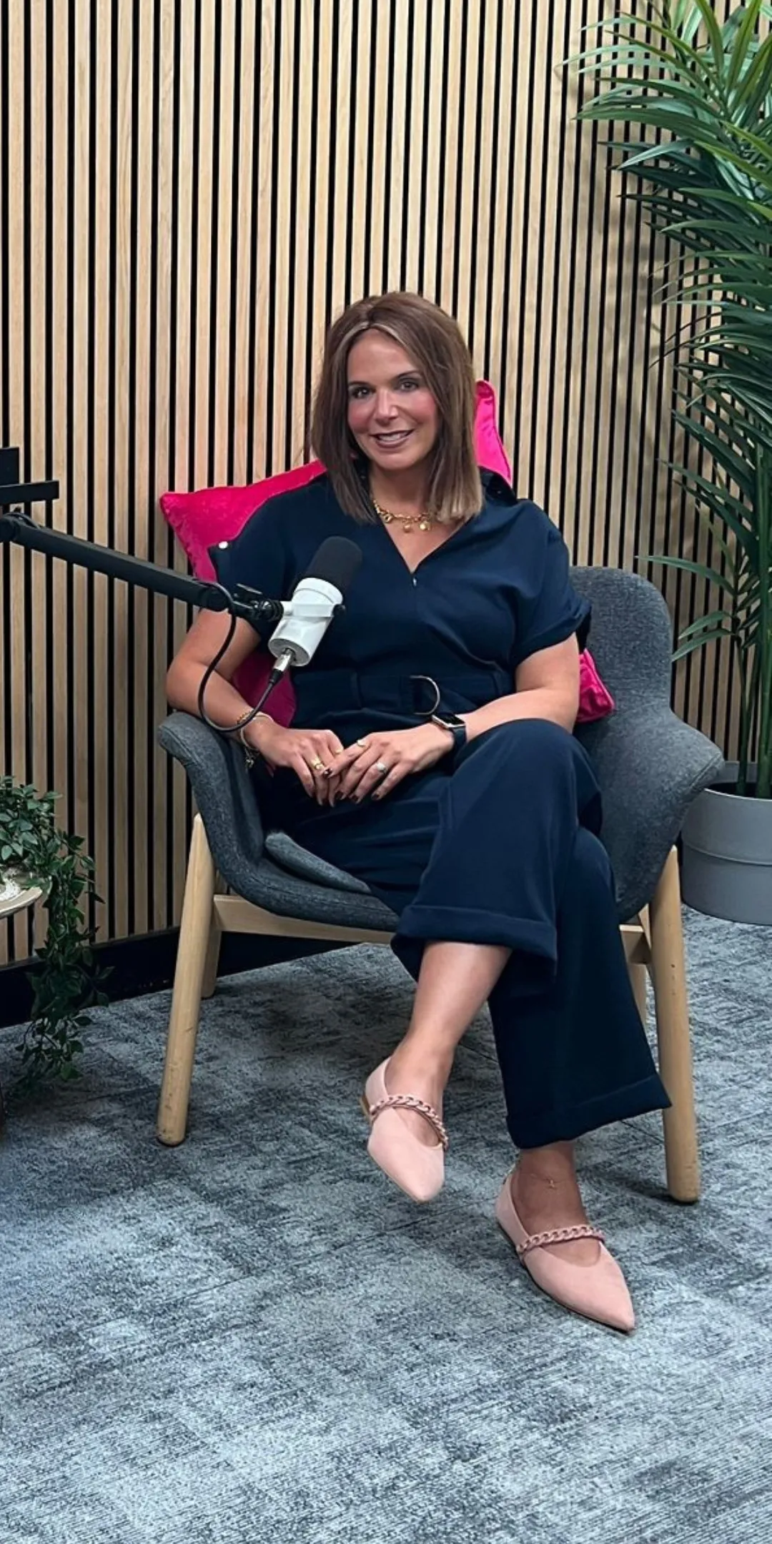Marcie Shaoul Seated with A Microphone