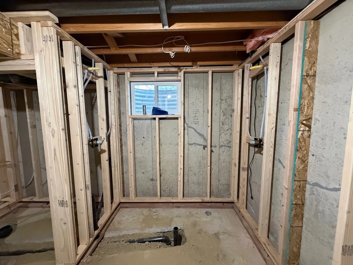 Basement framing around a window opening during a Denver-area basement remodel