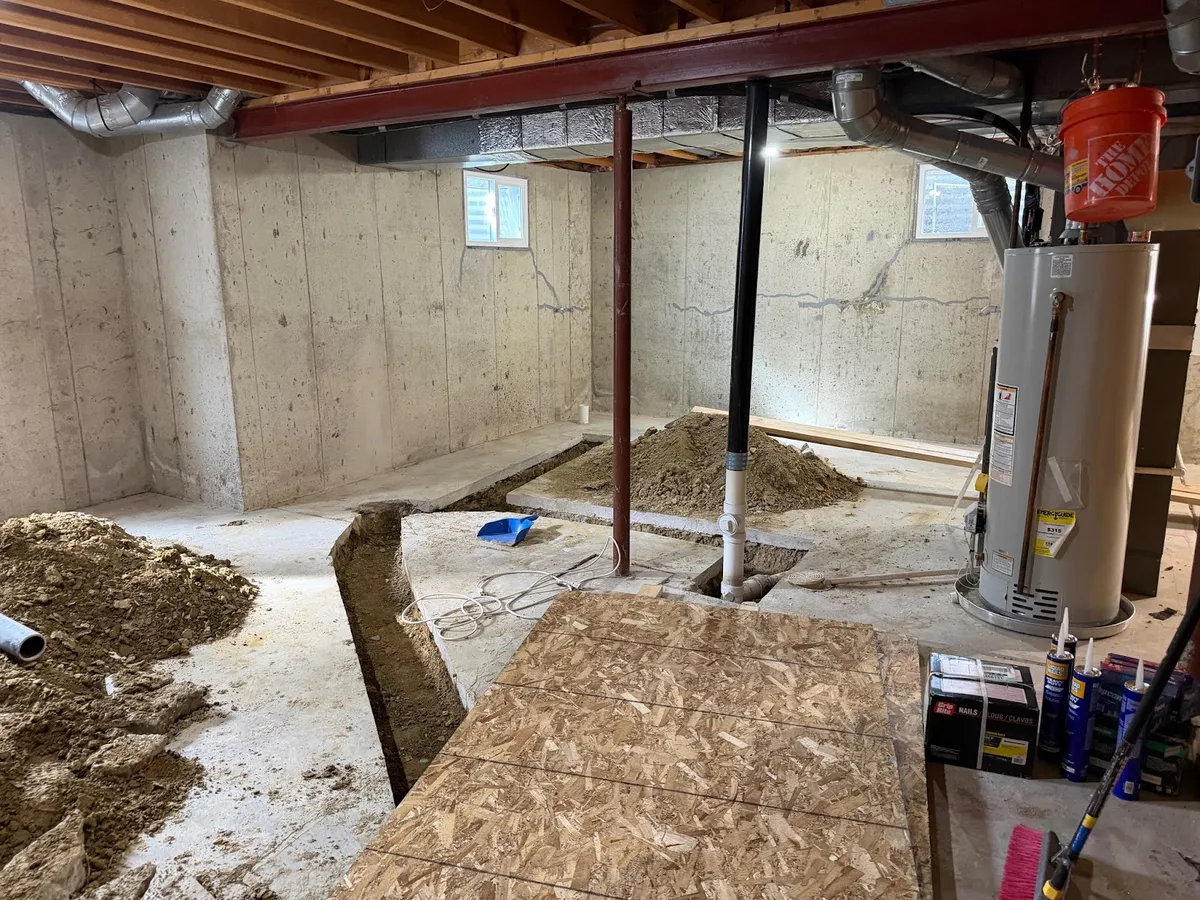 unfinished basement before finishing a basement in colorado, showing foundation walls
