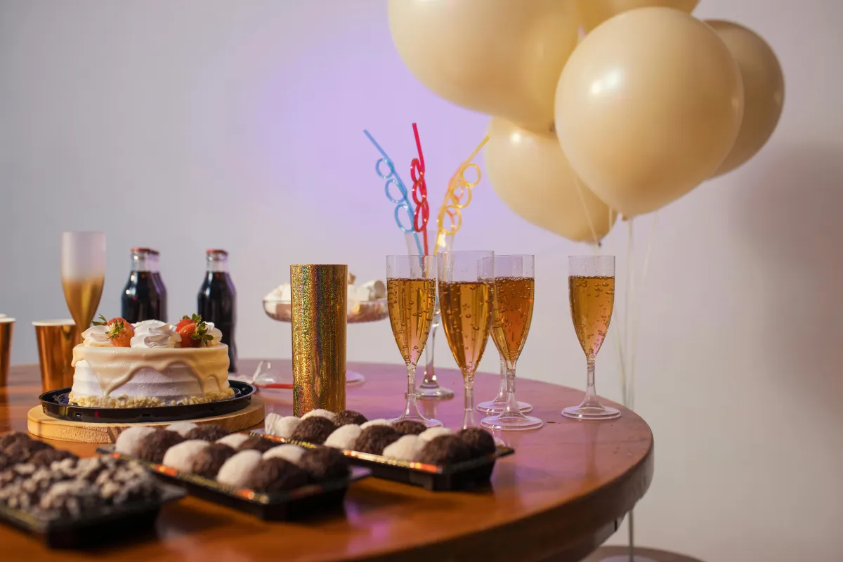 birthday celebration with wines and cake