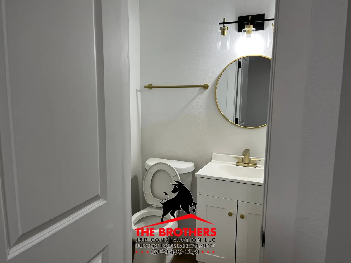 Bathroom remodeling with modern vanity and mirror installation in Lewes Delaware
