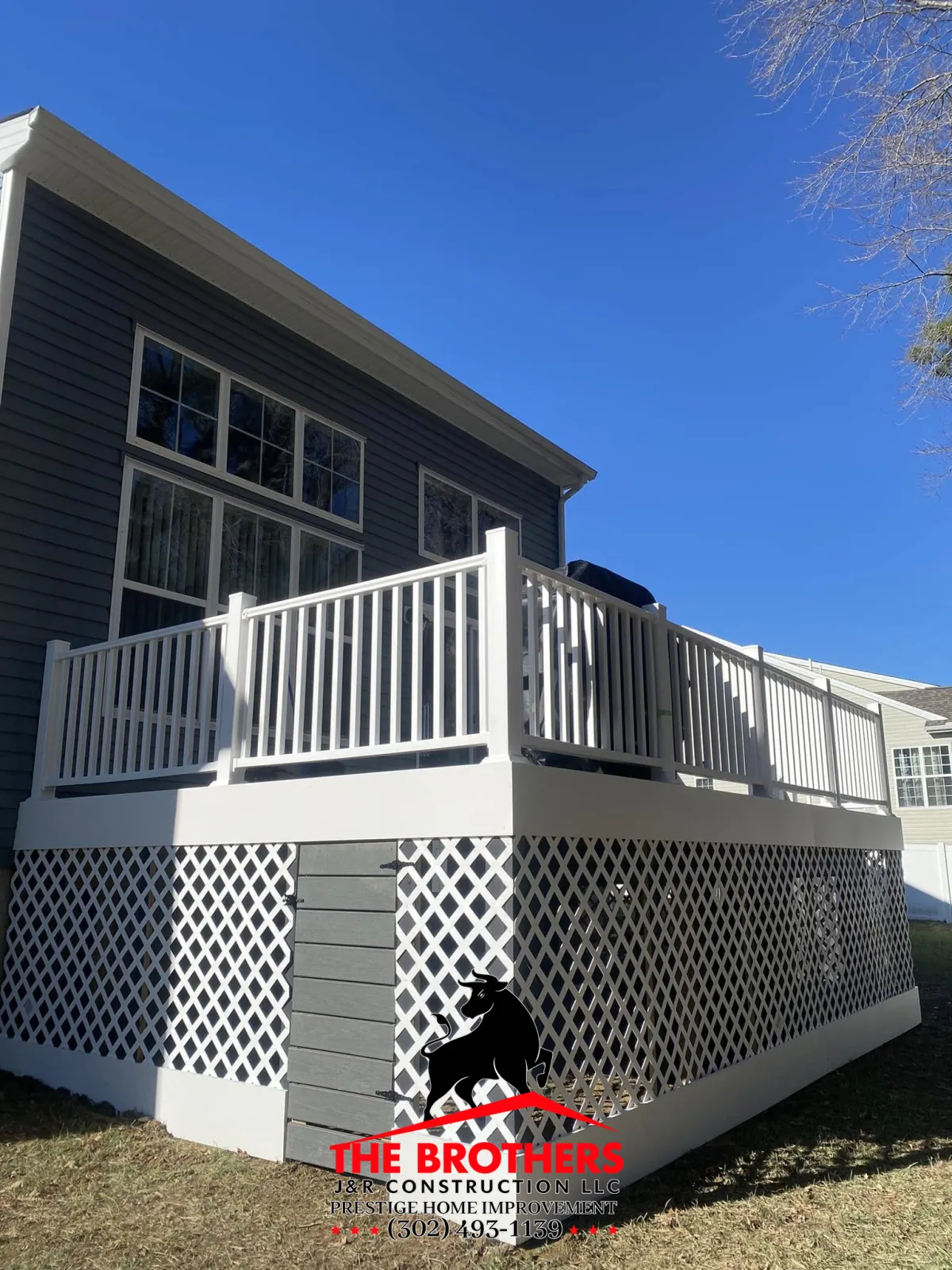 Finished backyard deck with railing and skirting in Lewes DE home improvement project